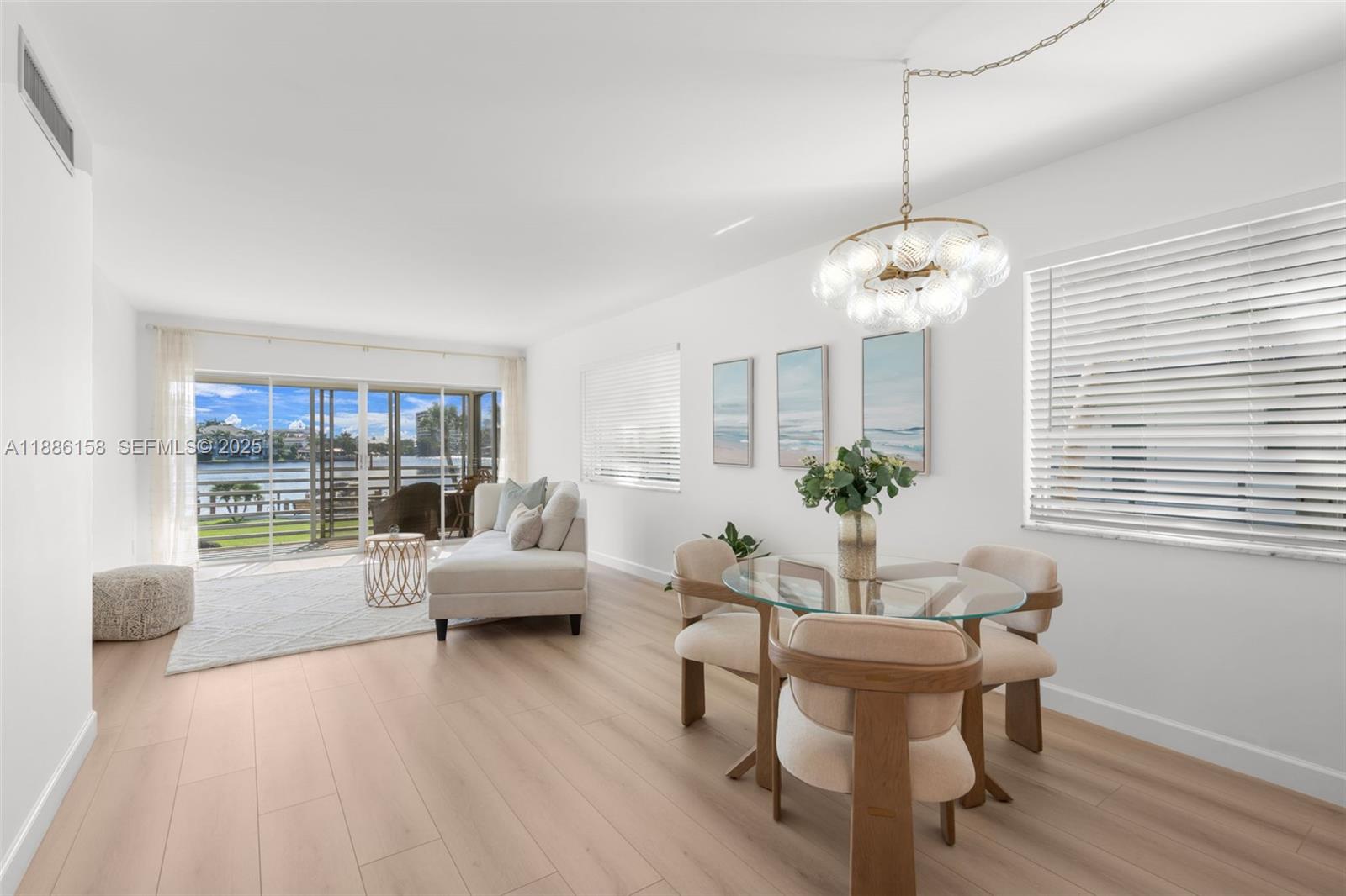3301 Spanish Trail, Unit 207 Delray Beach, FL 33483 - Photo 4 of 38 a view of a livingroom with furniture window and wooden floor