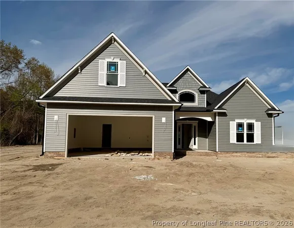 a front view of a house with yard