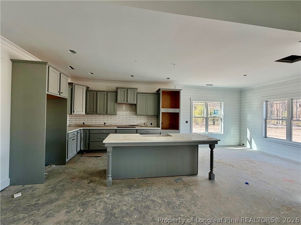 1744 Alderman Mill Road Dunn, NC 28334 - Photo 2 of 3 a kitchen with stainless steel appliances a sink stove and refrigerator