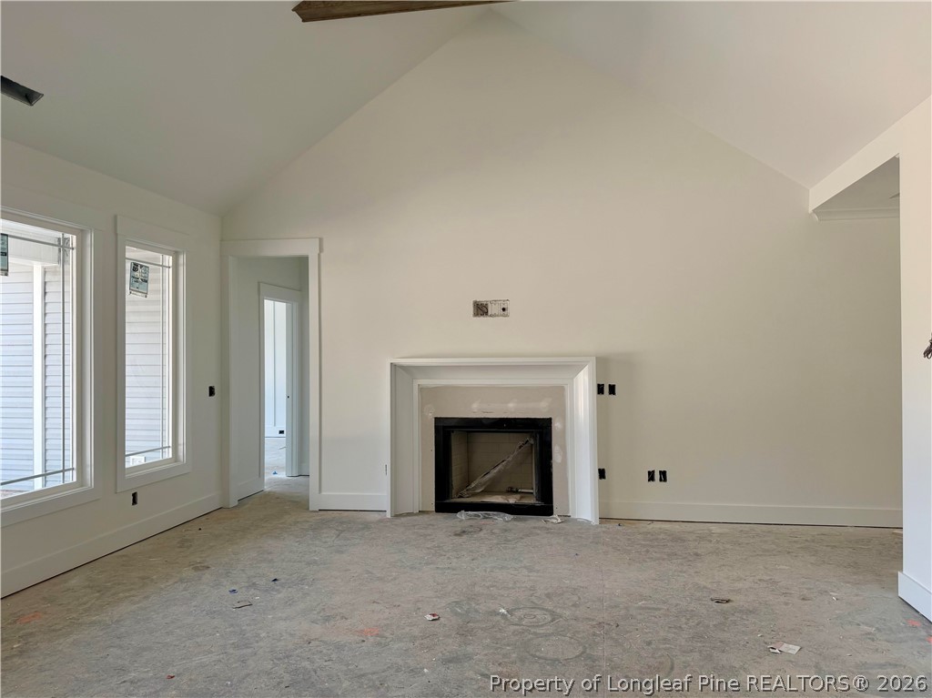 1744 Alderman Mill Road Dunn, NC 28334 - Photo 3 of 3 an empty room with a fireplace