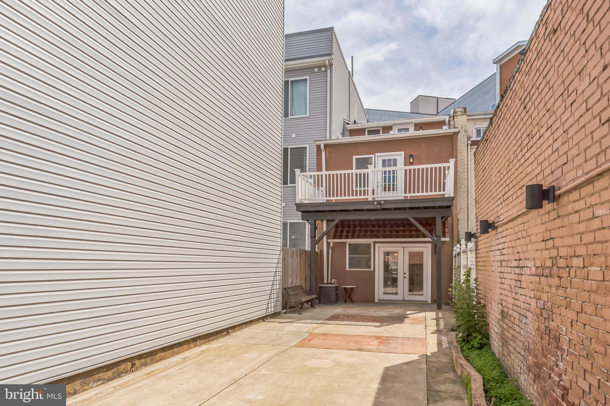 2123 East Norris Street Philadelphia, PA 19125 - Photo 12 of 40 a front view of a house with a garage