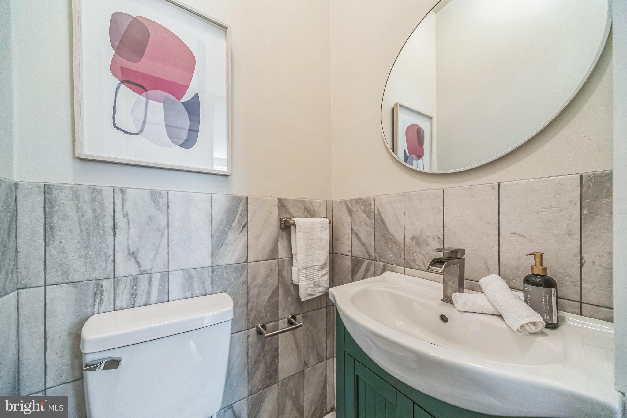 2123 East Norris Street Philadelphia, PA 19125 - Photo 13 of 40 a bathroom with a sink and a mirror