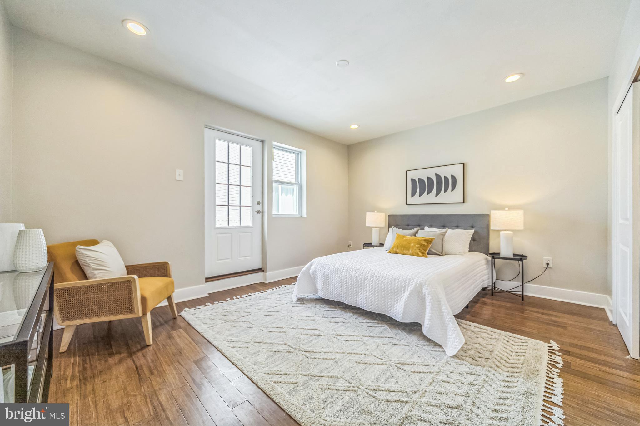 2123 East Norris Street Philadelphia, PA 19125 - Photo 14 of 40 a bedroom with a bed and wooden floor