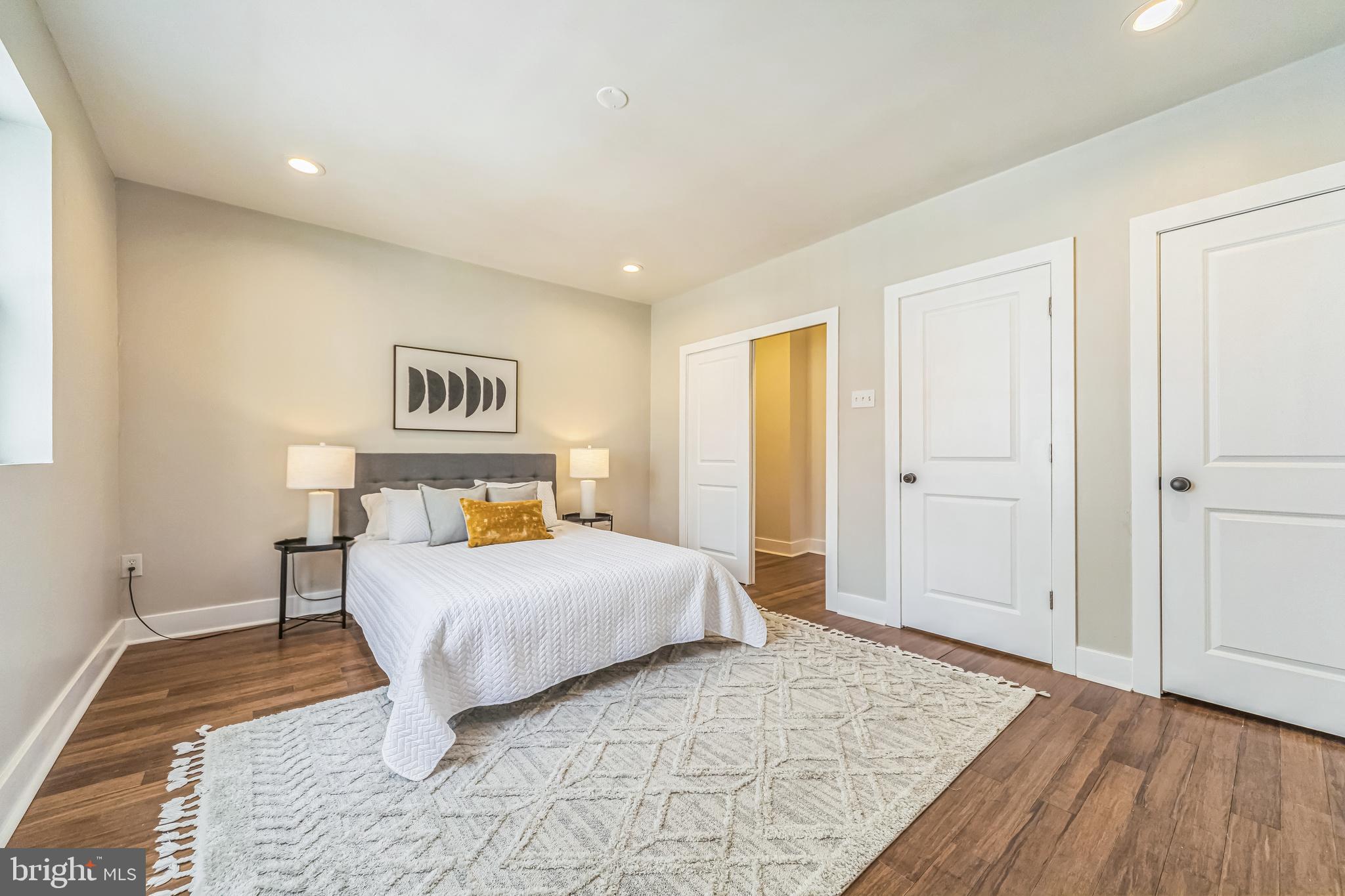 2123 East Norris Street Philadelphia, PA 19125 - Photo 15 of 40 a bedroom with a bed and painting on the wall
