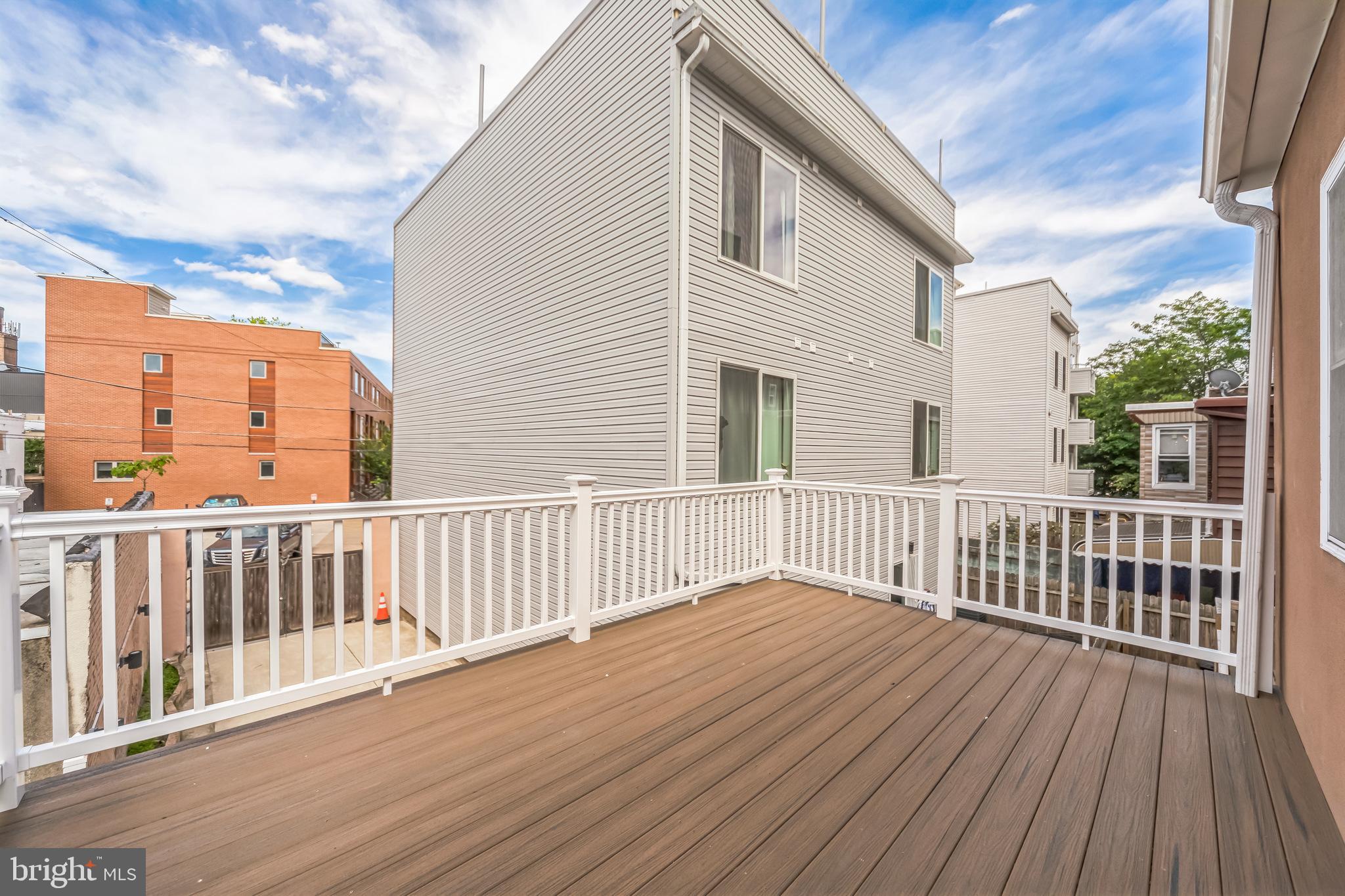 2123 East Norris Street Philadelphia, PA 19125 - Photo 18 of 40 a view of a wooden deck with a yard
