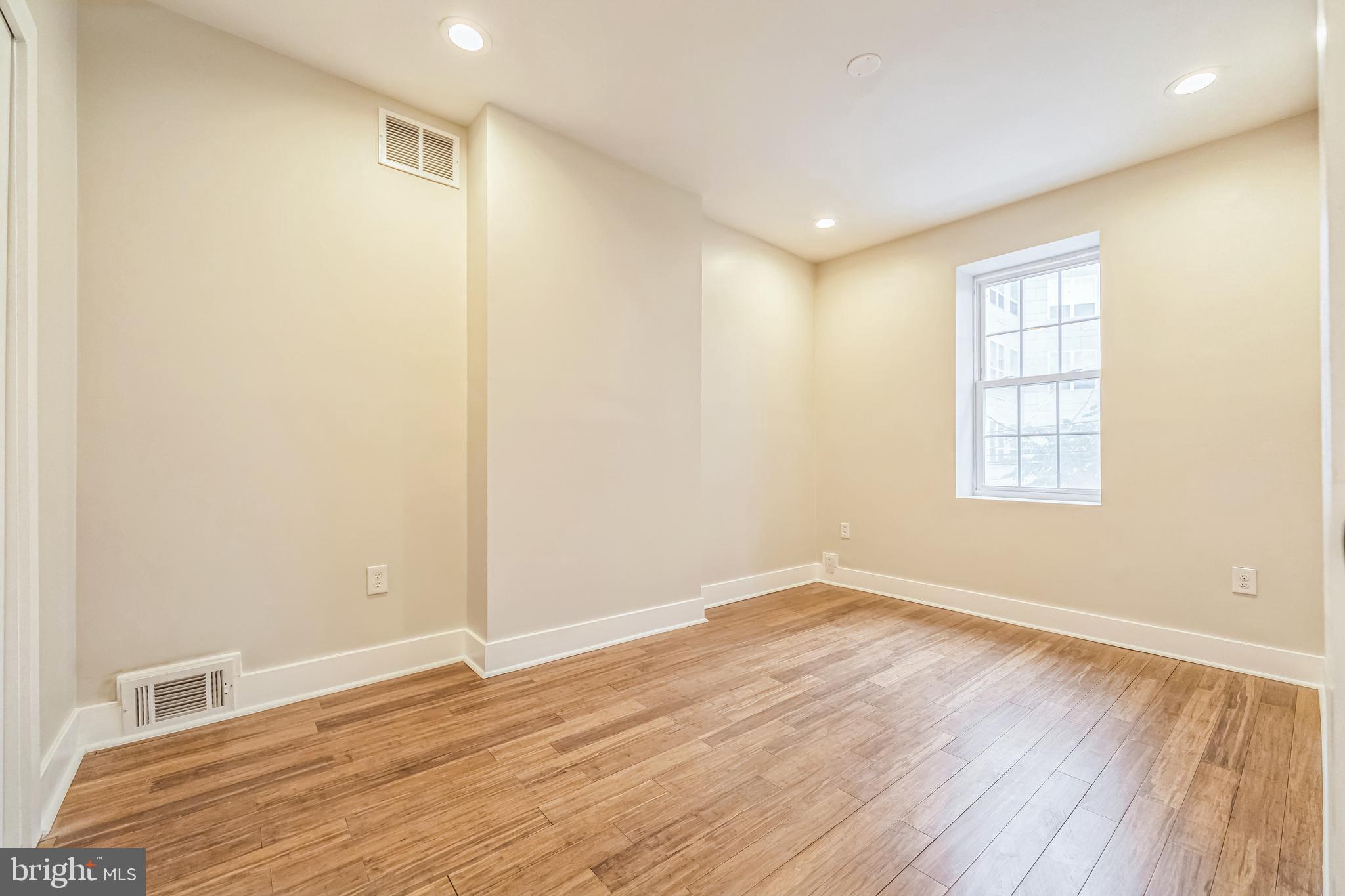 2123 East Norris Street Philadelphia, PA 19125 - Photo 20 of 40 a view of empty room with wooden floor and fan