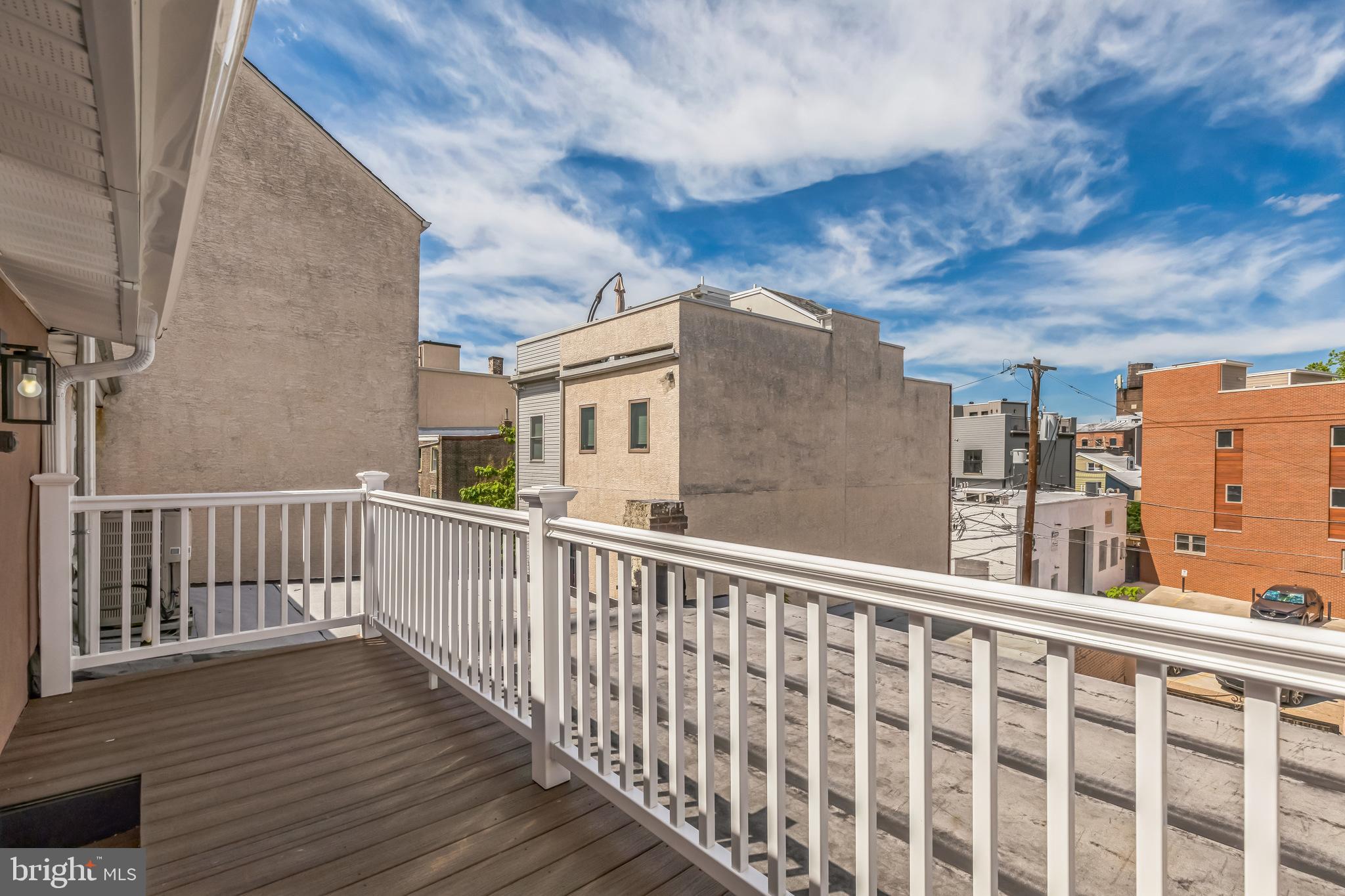 2123 East Norris Street Philadelphia, PA 19125 - Photo 23 of 40 a view of a balcony with wooden floor