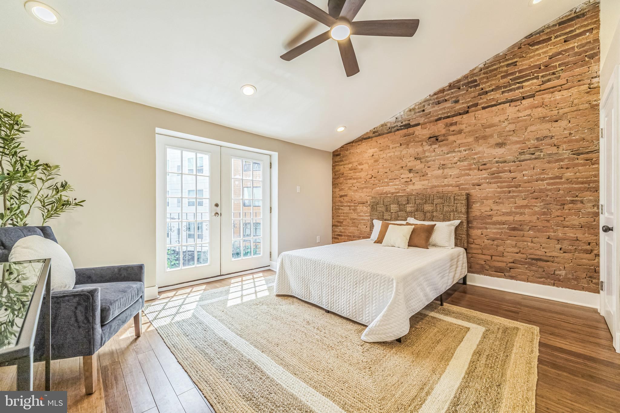 2123 East Norris Street Philadelphia, PA 19125 - Photo 24 of 40 a bedroom with a large bed and a window