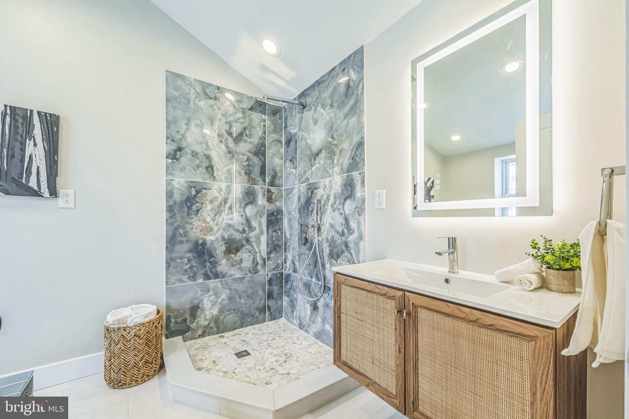 2123 East Norris Street Philadelphia, PA 19125 - Photo 26 of 40 a bathroom with a sink and a mirror