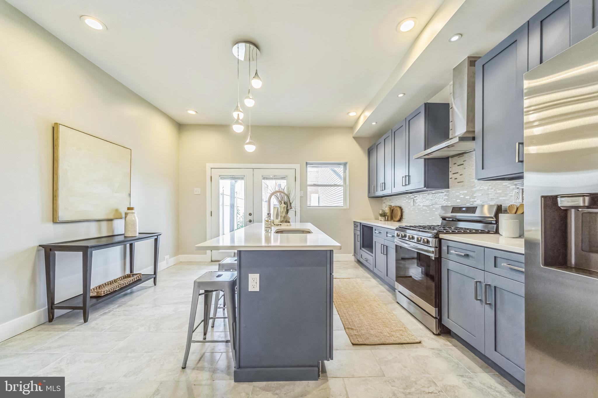 2123 East Norris Street Philadelphia, PA 19125 - Photo 10 of 40 a large kitchen with stainless steel appliances lots of counter space and breakfast area