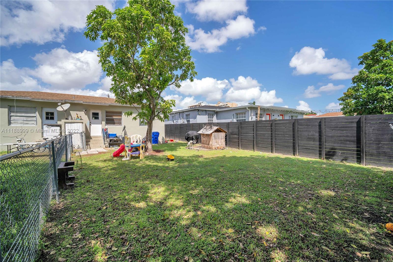 2800 Southwest 25th Street Miami, FL 33133 - Photo 12 of 19 a view of a house with a backyard and a garden