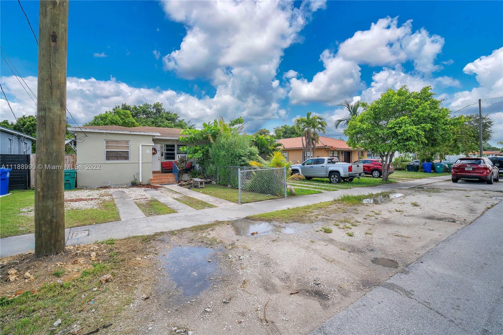 2800 Southwest 25th Street Miami, FL 33133 - Photo 18 of 19 a view of a house with a backyard and a tree