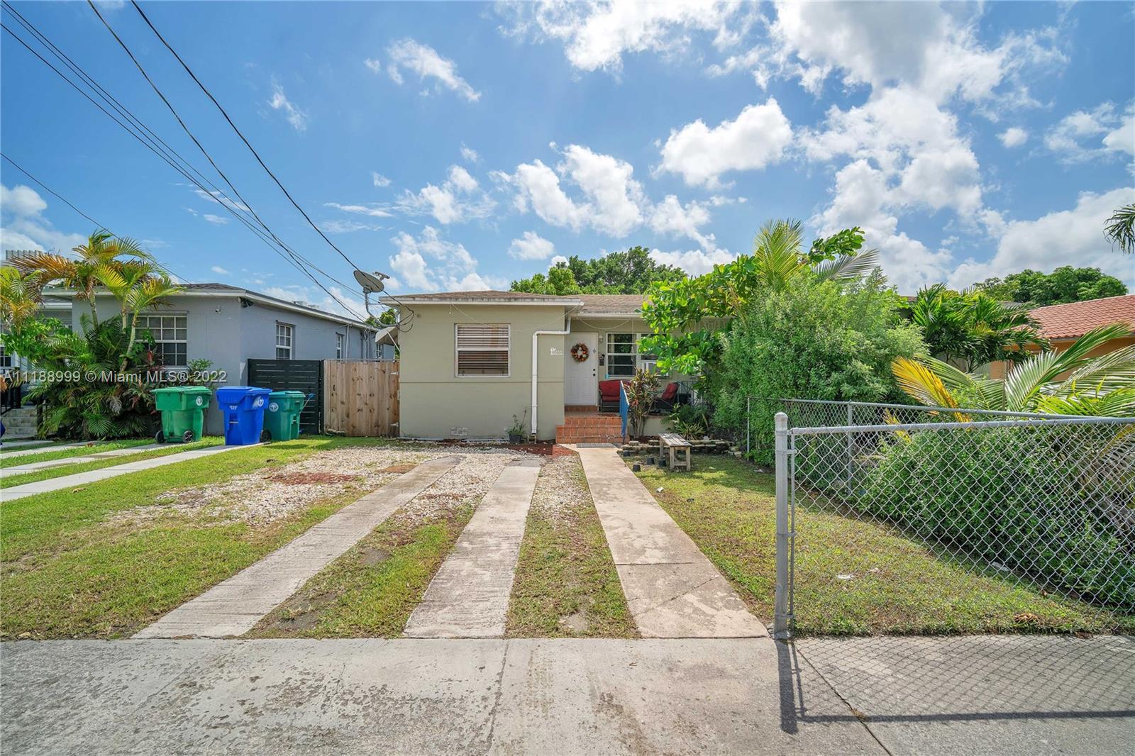 2800 Southwest 25th Street Miami, FL 33133 - Photo 4 of 19 a view of backyard of house and car parked