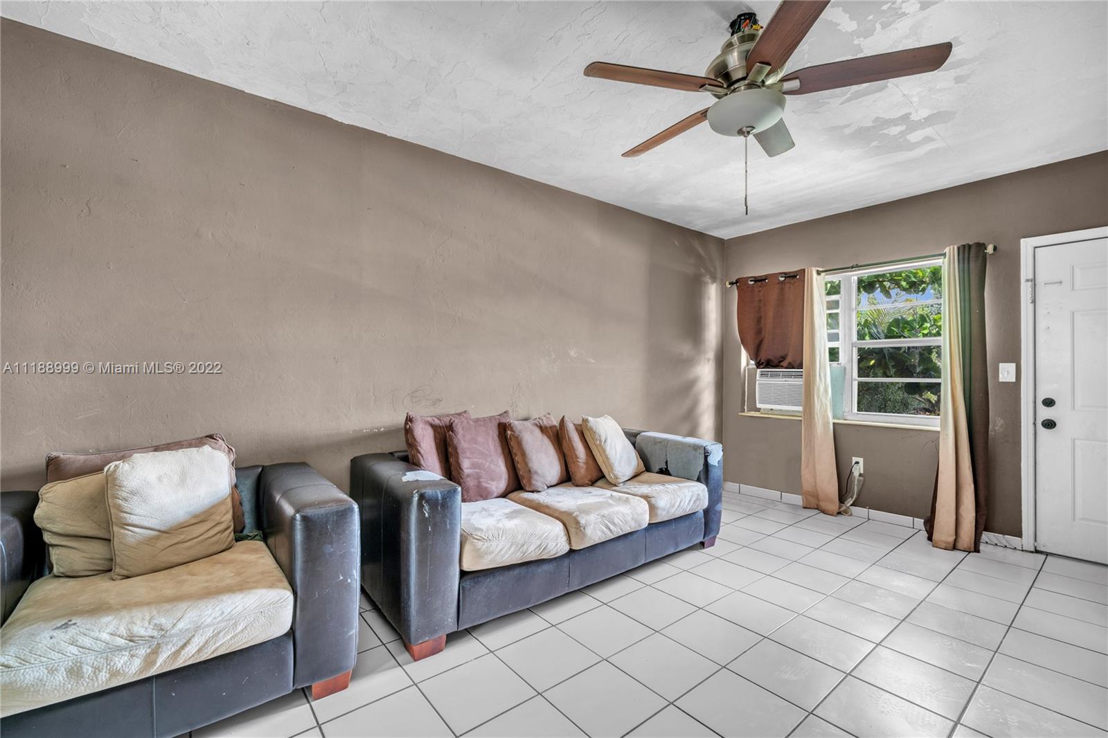 2800 Southwest 25th Street Miami, FL 33133 - Photo 6 of 19 a living room with furniture and a ceiling fan