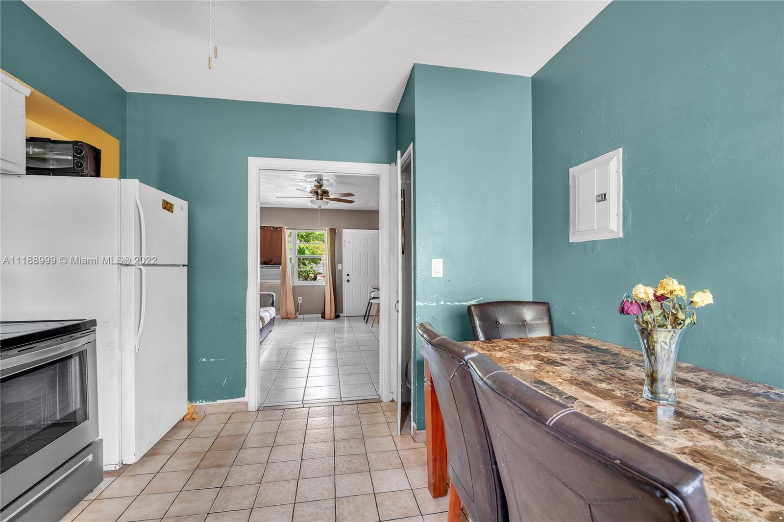 2800 Southwest 25th Street Miami, FL 33133 - Photo 9 of 19 a kitchen with refrigerator and cabinets