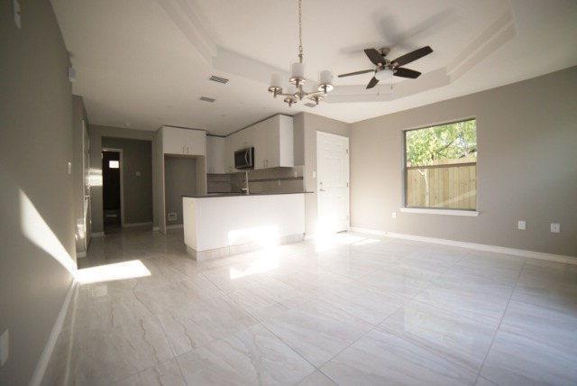 1310 West Harrison Avenue, Unit 2 Alton, TX 78573 - Photo 2 of 11 a view of an empty room with a window