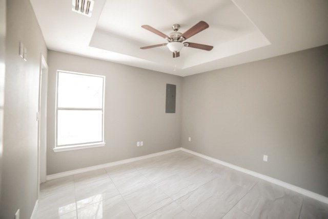 1310 West Harrison Avenue, Unit 2 Alton, TX 78573 - Photo 8 of 11 an empty room with a window and a fan