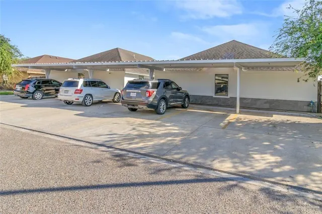 a view of a car park in front of house