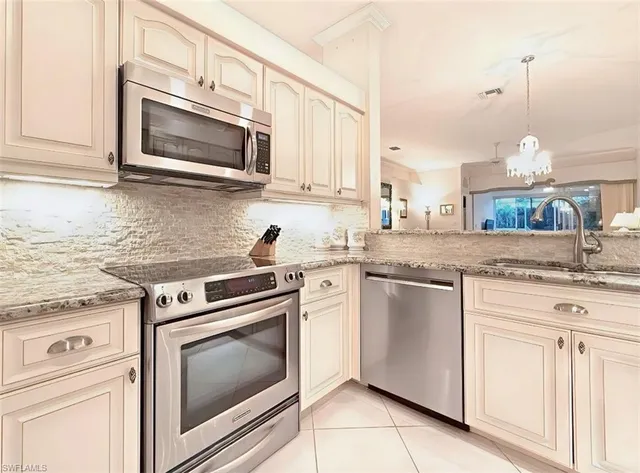 $690,000 | 8854 Naples Heritage Drive, Unit E1, Naples, FL 34112