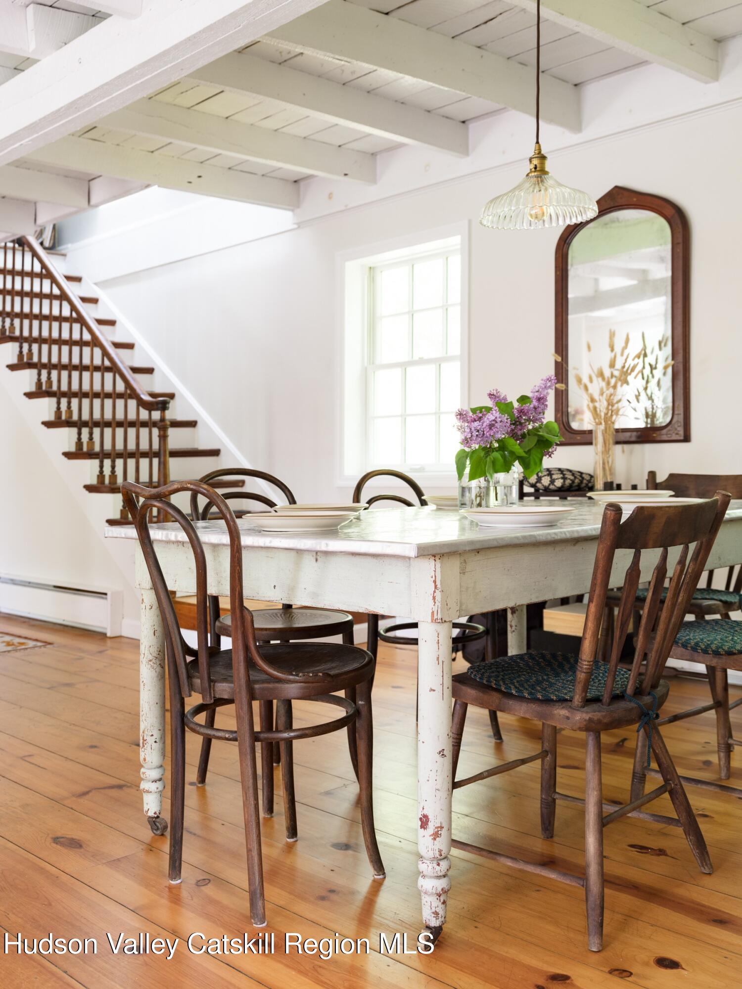271 Texas Hill Road Hillsdale, NY 12521 - Photo 14 of 29 a view of a dining room with furniture and a chandelier