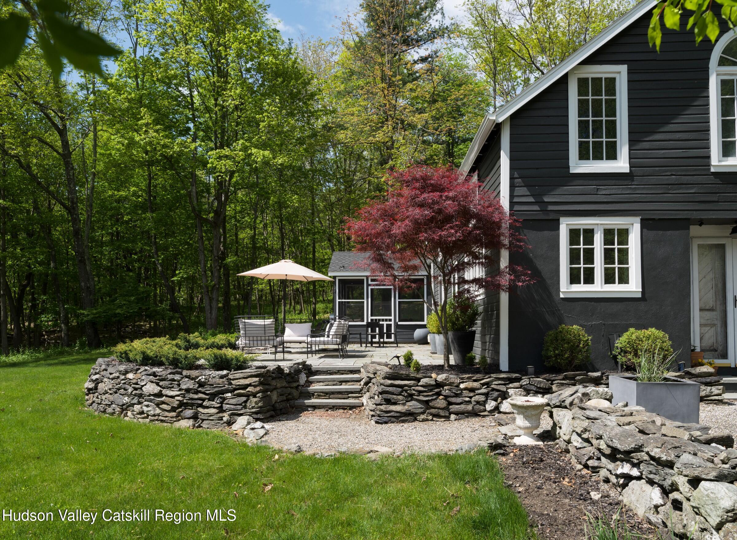 271 Texas Hill Road Hillsdale, NY 12521 - Photo 26 of 29 a front view of a house with garden and sitting area