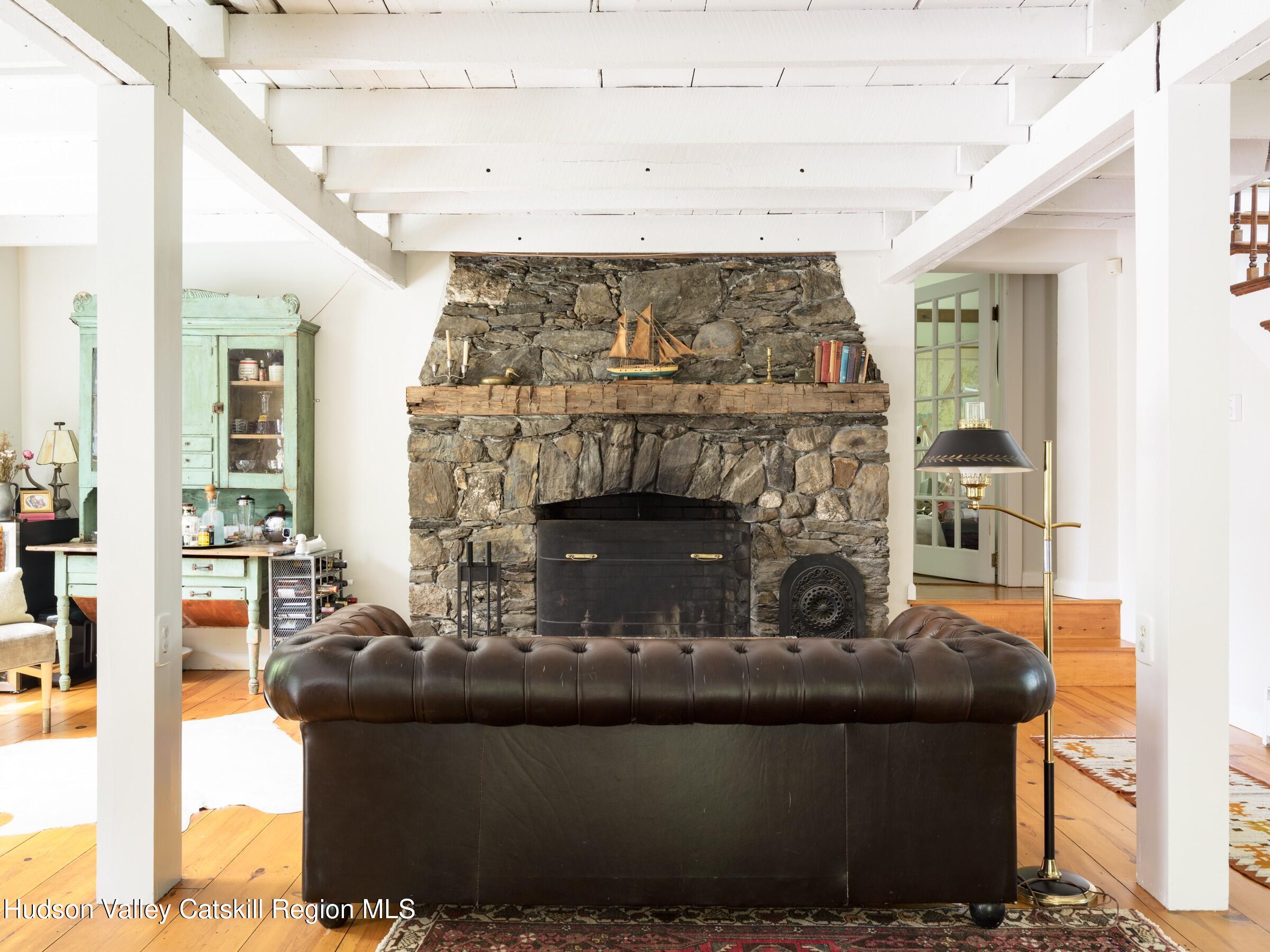 271 Texas Hill Road Hillsdale, NY 12521 - Photo 3 of 29 a living room with furniture and a fireplace