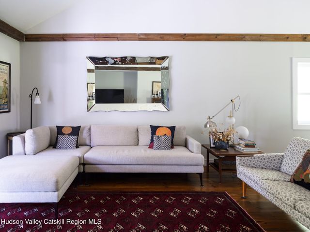 a living room with furniture and a rug