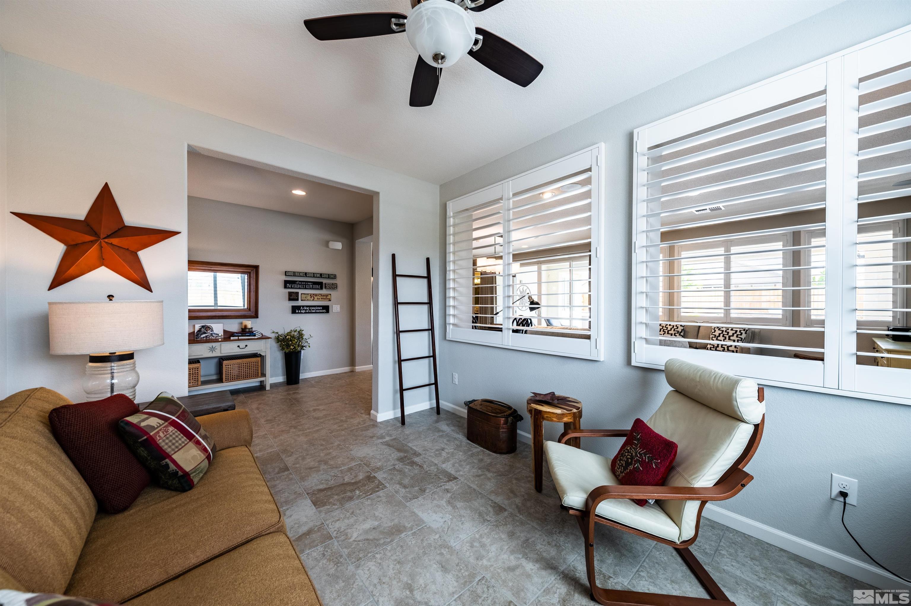 9860 Nahar Lane Reno, NV 89521 - Photo 16 of 40 a living room with furniture and a large window