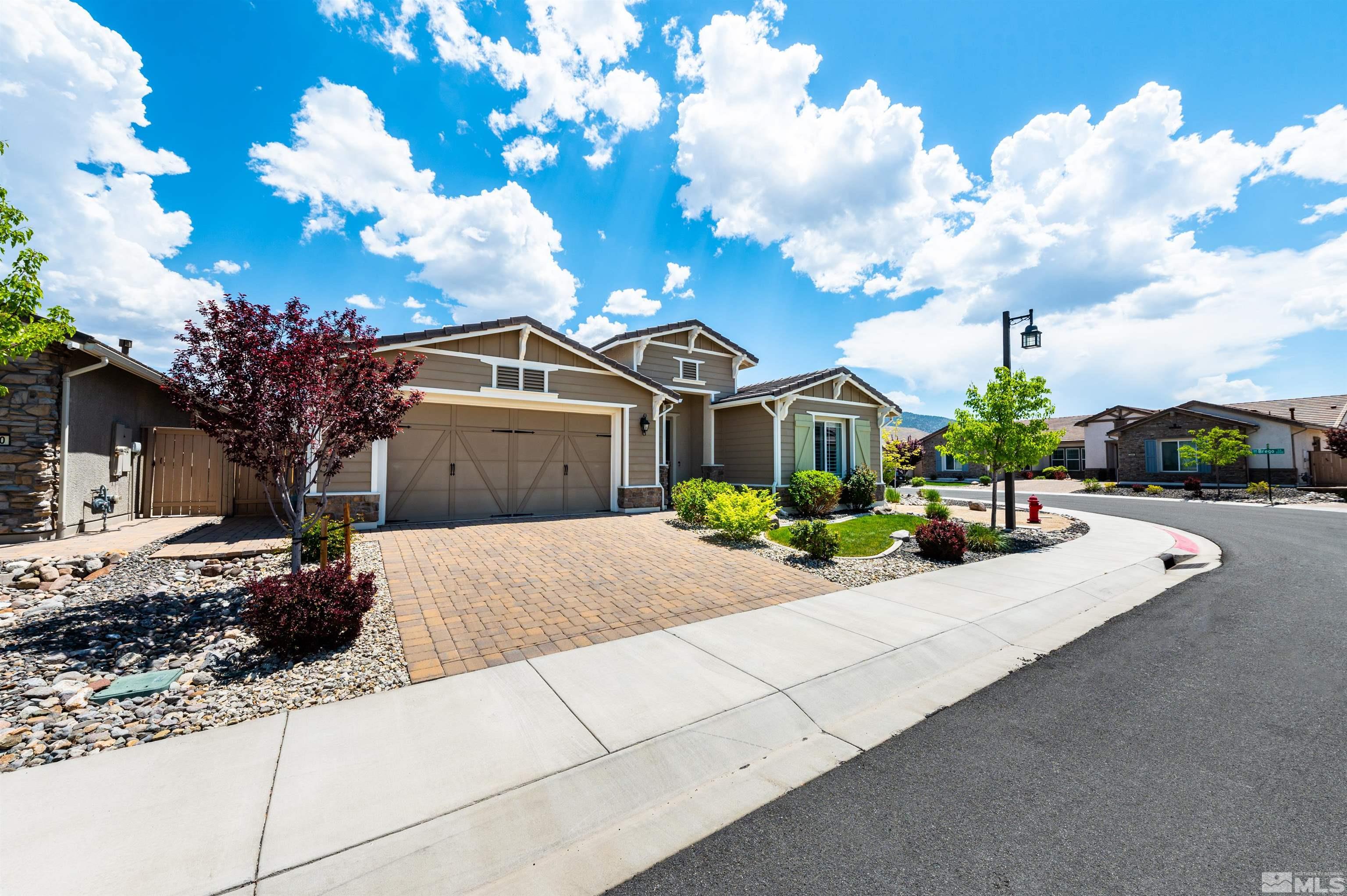 9860 Nahar Lane Reno, NV 89521 - Photo 2 of 40 a front view of a house with a yard and garage