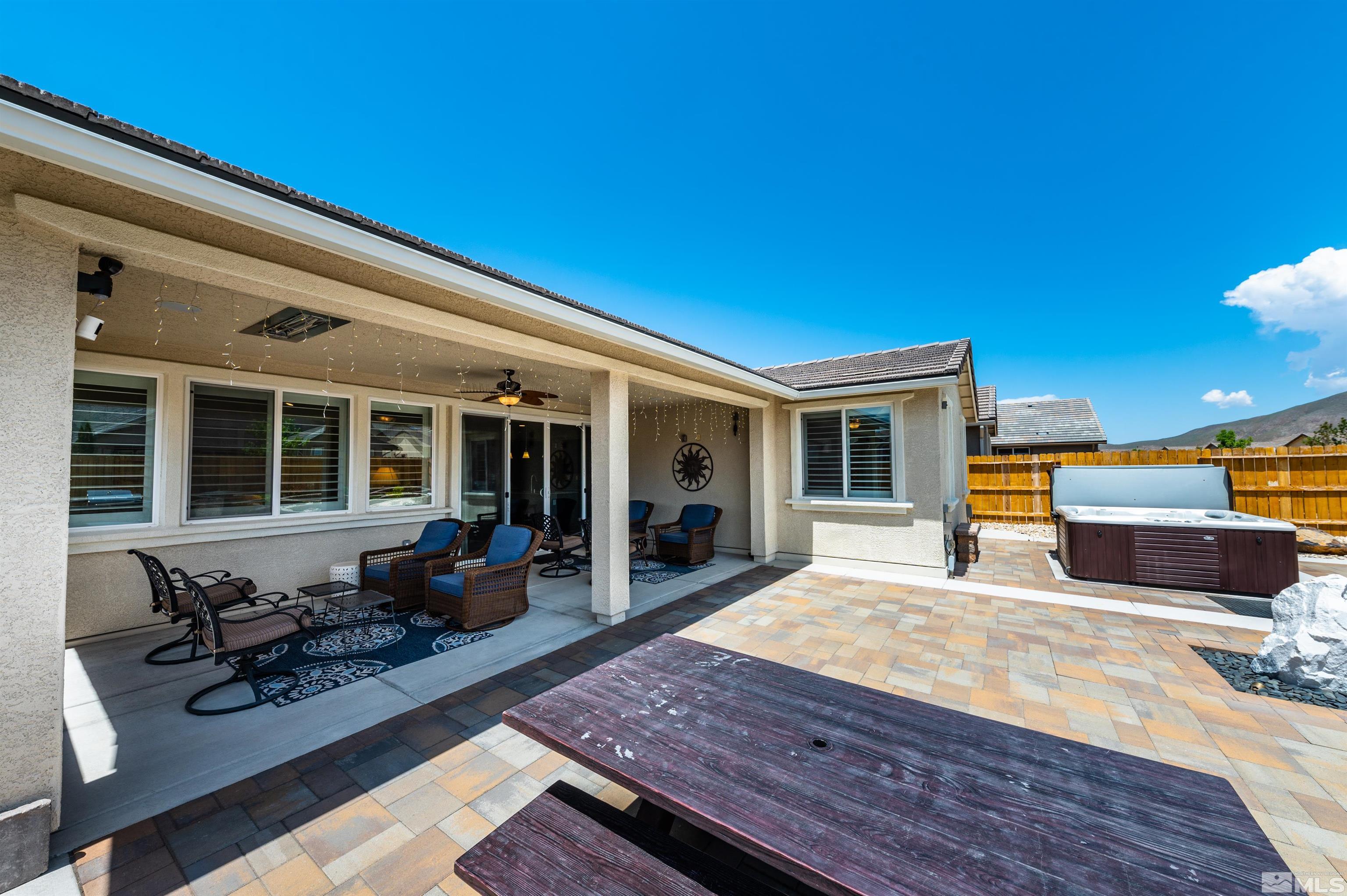 9860 Nahar Lane Reno, NV 89521 - Photo 24 of 40 a house view with a seating space and a potted plant