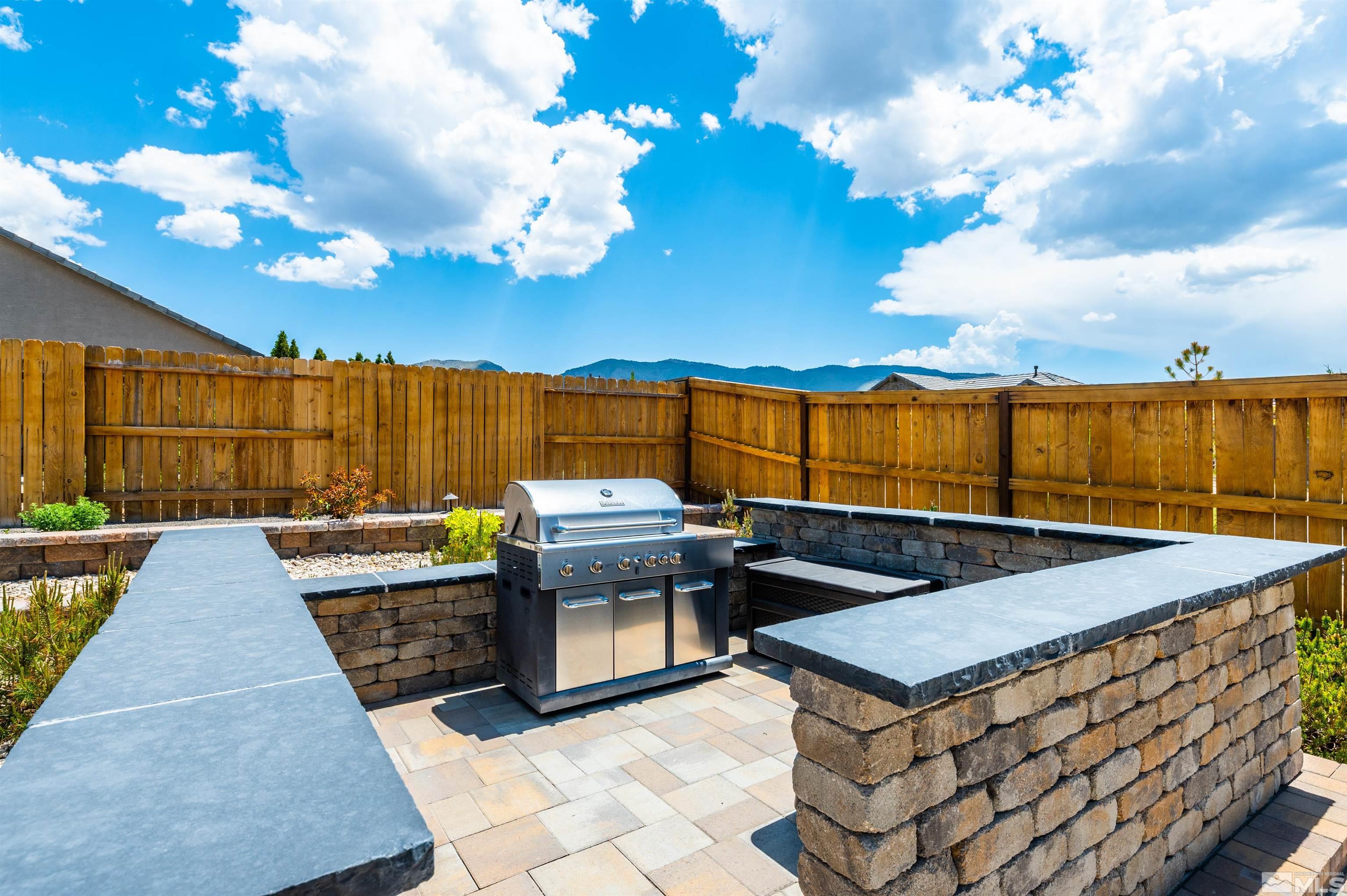 9860 Nahar Lane Reno, NV 89521 - Photo 27 of 40 a view of a terrace with couches and sky view