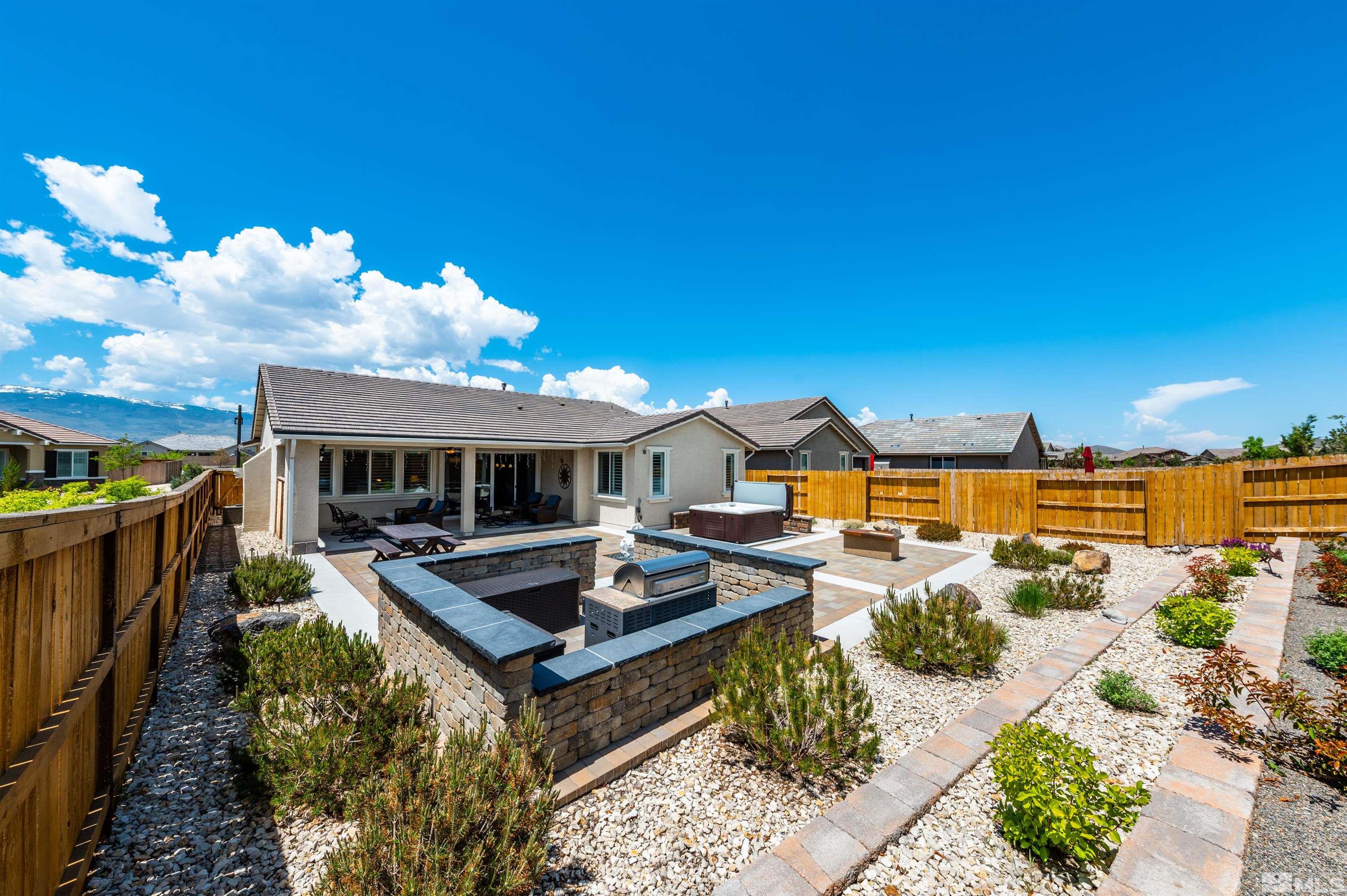 9860 Nahar Lane Reno, NV 89521 - Photo 28 of 40 a front view of a house with garden