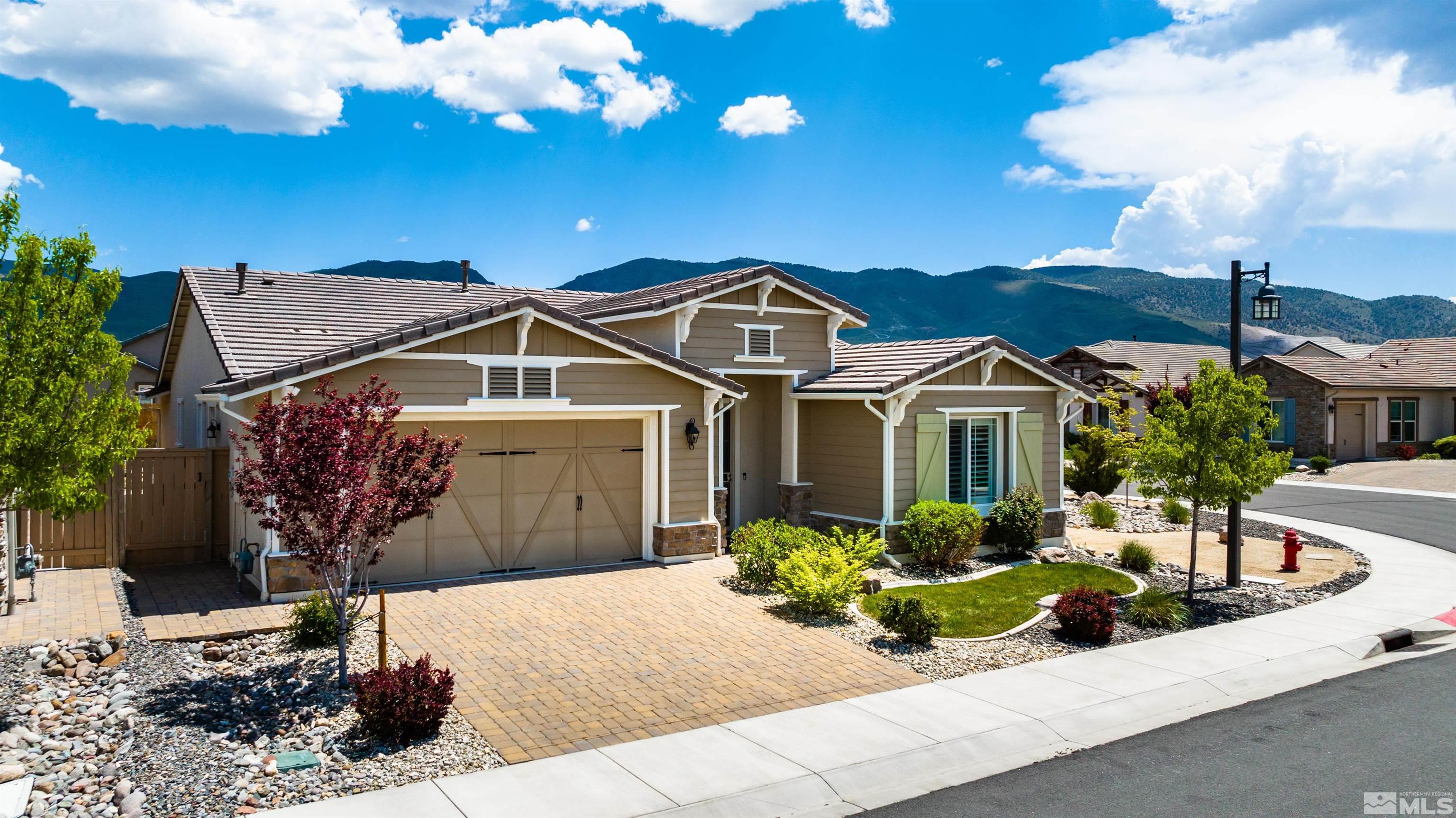 9860 Nahar Lane Reno, NV 89521 - Photo 3 of 40 a front view of a house with a yard