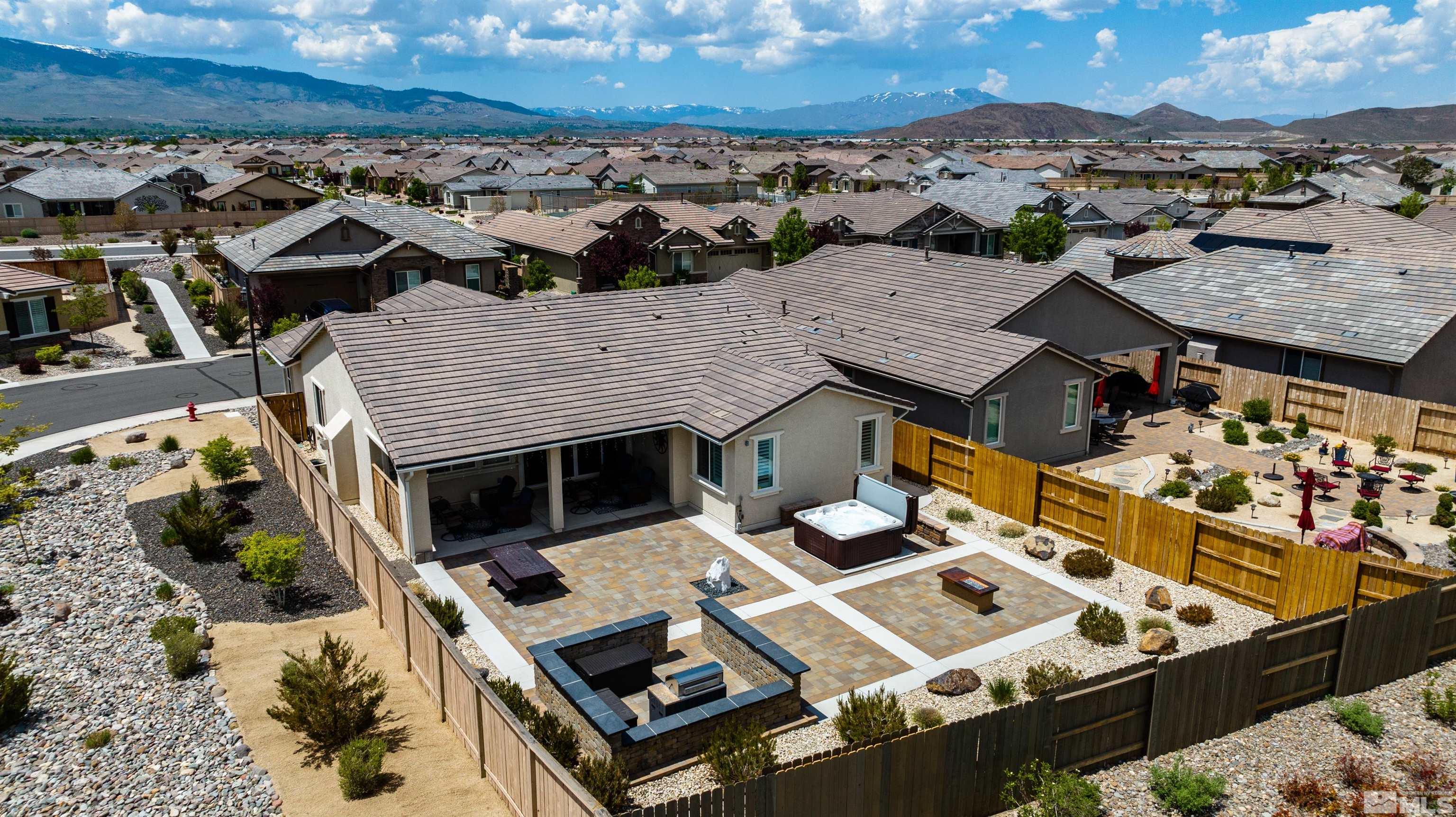 9860 Nahar Lane Reno, NV 89521 - Photo 31 of 40 an aerial view of a house with a mountain