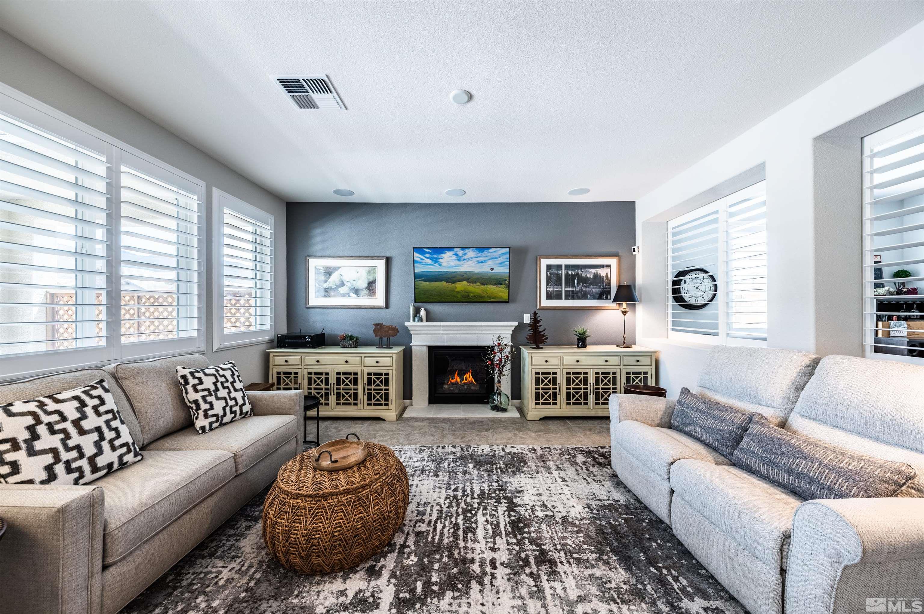 9860 Nahar Lane Reno, NV 89521 - Photo 8 of 40 a living room with furniture and a fireplace