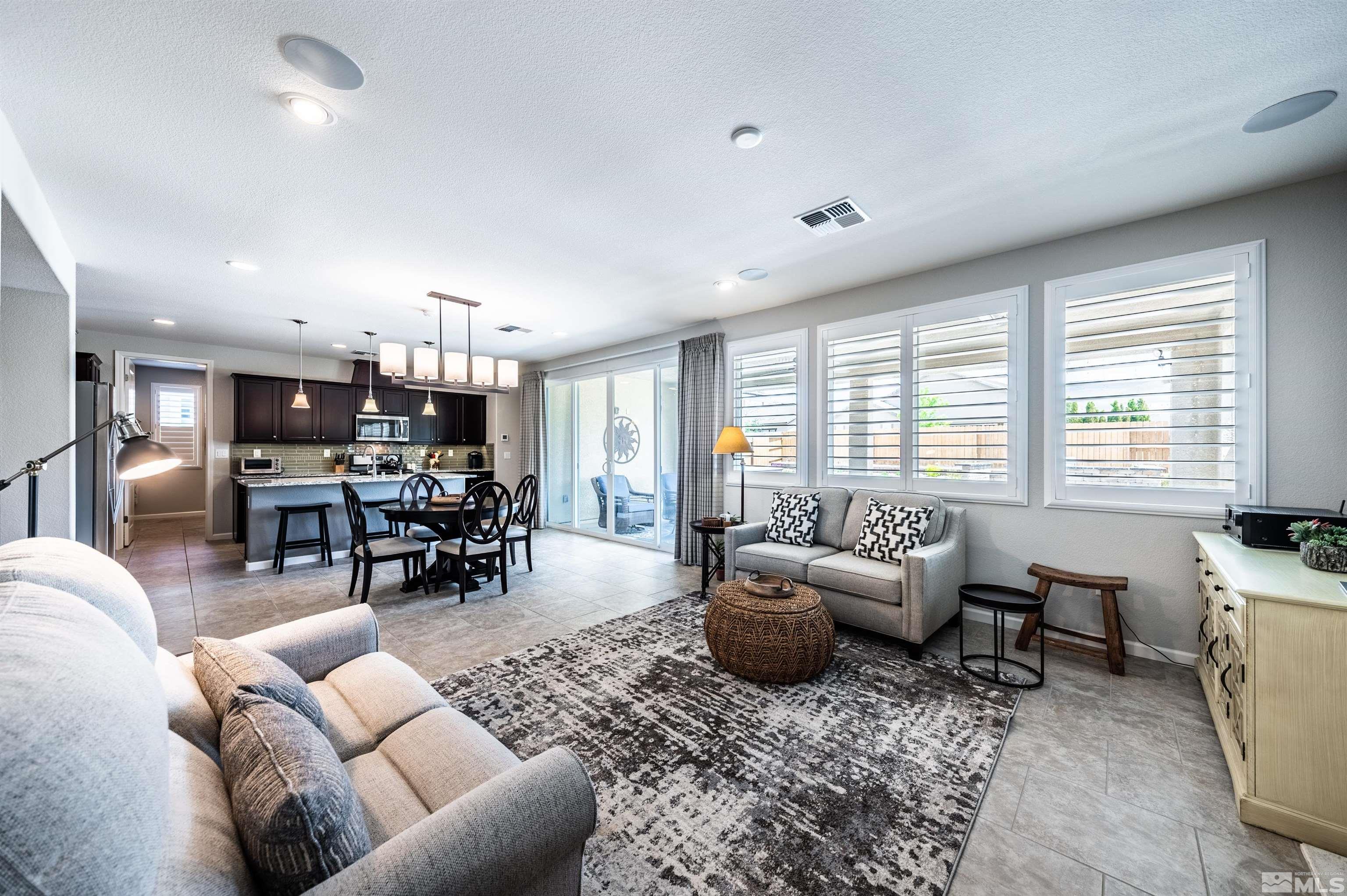 9860 Nahar Lane Reno, NV 89521 - Photo 9 of 40 a living room with furniture and a large window