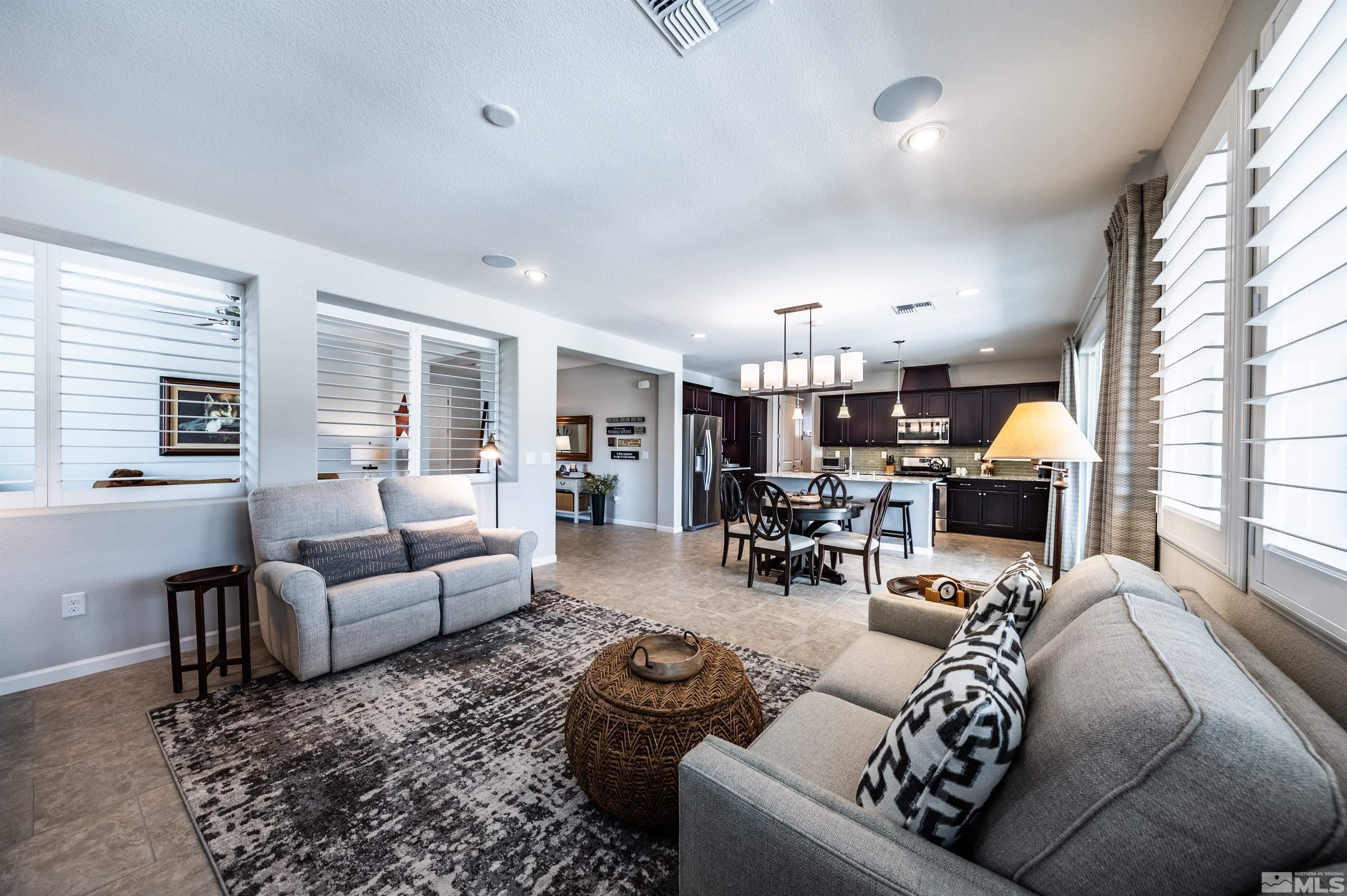 9860 Nahar Lane Reno, NV 89521 - Photo 10 of 40 a living room with furniture and a large window
