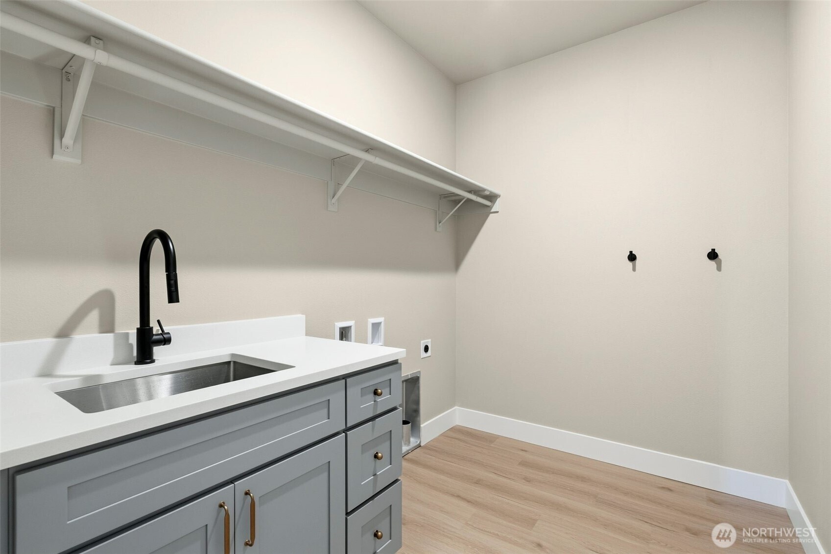 254 Windy Ridge Drive Longview, WA 98632 - Photo 22 of 27 a kitchen with a sink and wooden floor