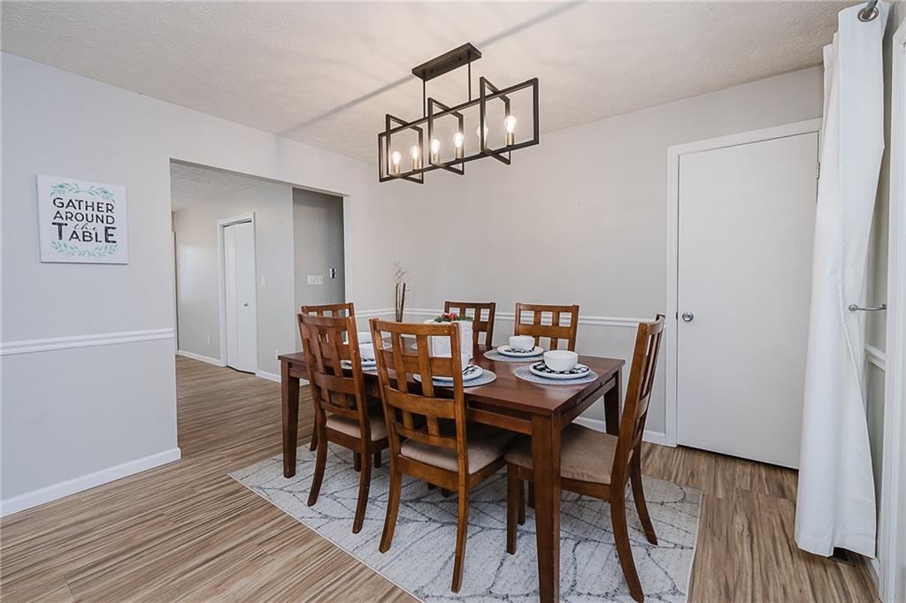 979 Barclay Road Indiana, PA 15701 - Photo 14 of 32 a view of a dining room with furniture a chandelier and wooden floor