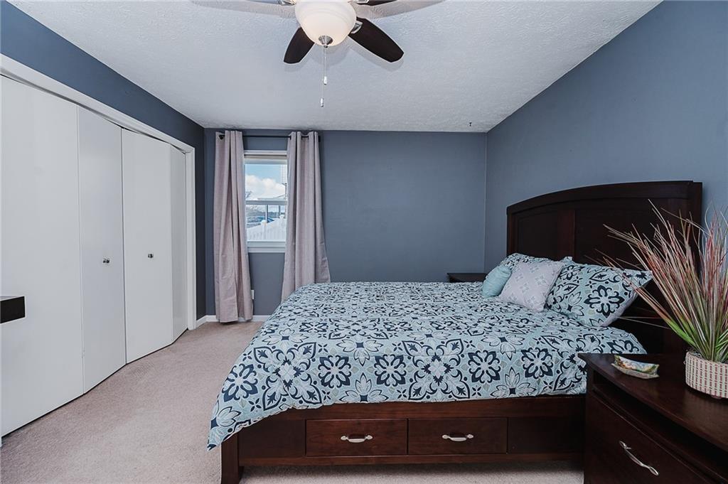 979 Barclay Road Indiana, PA 15701 - Photo 18 of 32 a bedroom with a bed and ceiling fan