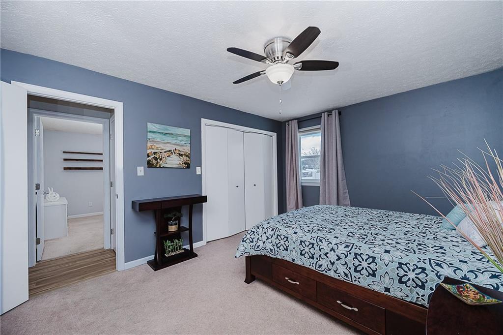 979 Barclay Road Indiana, PA 15701 - Photo 20 of 32 a bedroom with a bed and a chandelier