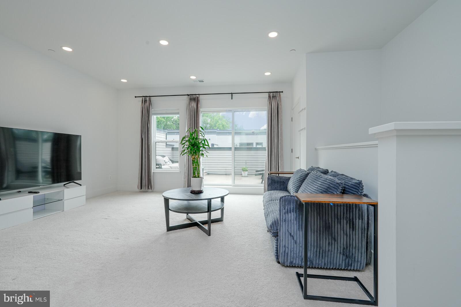 5345 Zenith Overlook Bethesda, MD 20816 - Photo 44 of 53 a living room with furniture and a flat screen tv