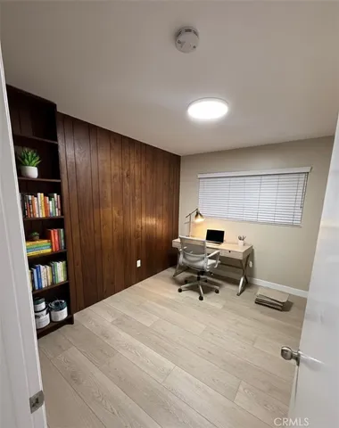 a bed room with a bed and a book shelf