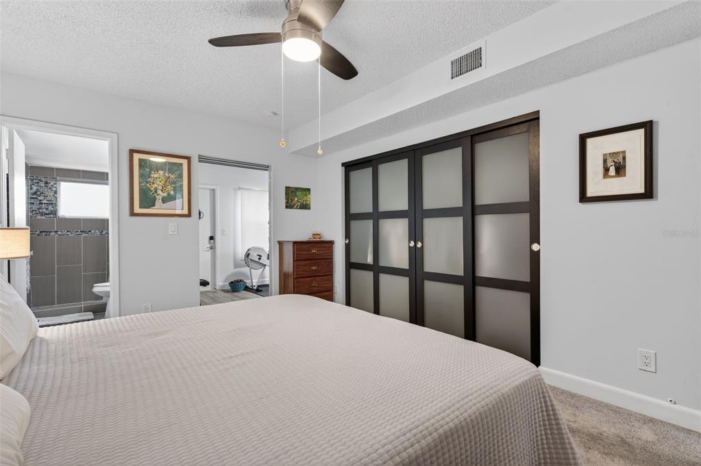 3740 58th Street North, Unit 110 St. Petersburg, FL 33710 - Photo 17 of 27 a bedroom with a large bed and a window