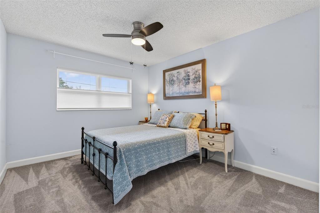 3740 58th Street North, Unit 110 St. Petersburg, FL 33710 - Photo 19 of 27 a bed room with a bed and a window