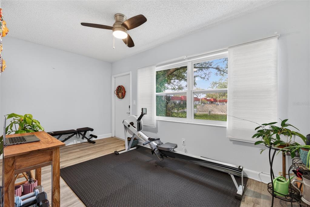 3740 58th Street North, Unit 110 St. Petersburg, FL 33710 - Photo 23 of 27 a room with gym equipment and a large window