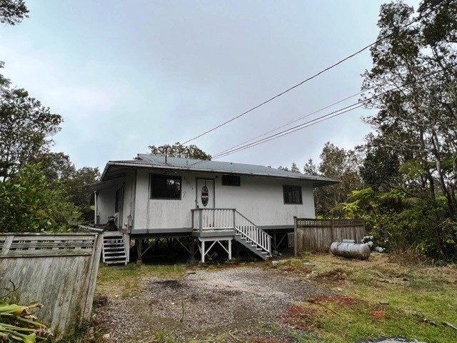 11-3715 Old Volcano Road Volcano, HI 96785 - Photo 1 of 14 a view of a house with a backyard and roof
