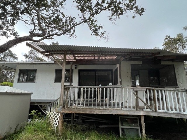 11-3715 Old Volcano Road Volcano, HI 96785 - Photo 12 of 14 a view of house with a deck and furniture