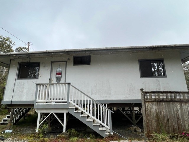 11-3715 Old Volcano Road Volcano, HI 96785 - Photo 13 of 14 a view of a roof deck with wooden fence and a floor