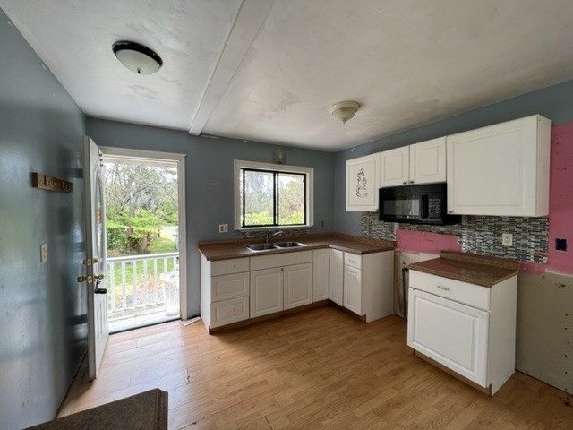 11-3715 Old Volcano Road Volcano, HI 96785 - Photo 2 of 14 a kitchen with sink a microwave and cabinets